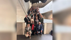Photo of a group in a stairwell.