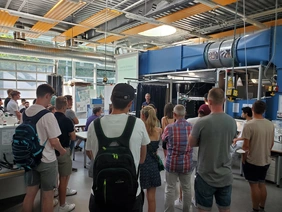 Applicants group in the laboratory in front of the wind tunnel