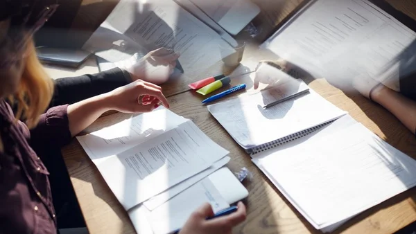 Illustration of a desk with various documents on it